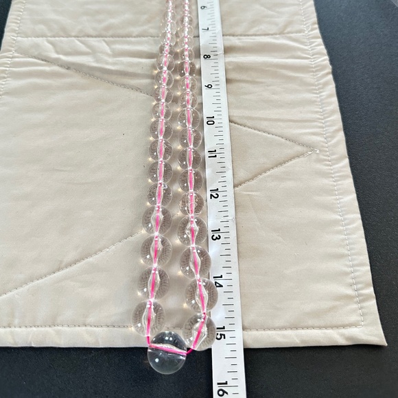 Graduating clear glass bead necklace strung on hot pink string. Lobster clasp - Picture 5 of 13